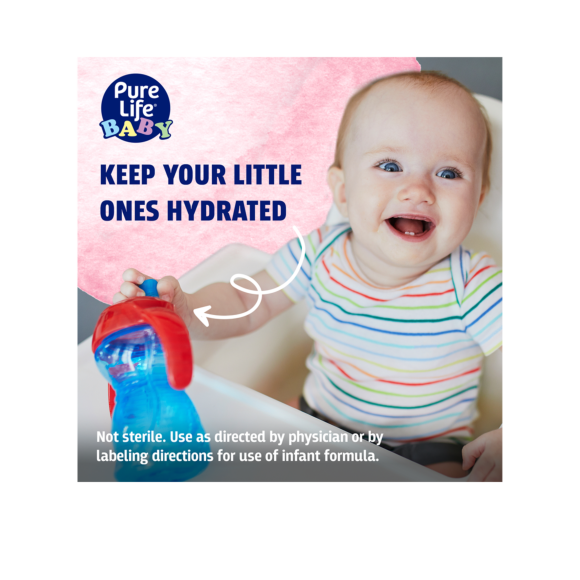 smiling infant holding formula bottle made with nursery water Image2